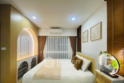 Modern bedroom with cozy lighting and stylish decor, featuring a comfortable bed and elegant wooden accents.