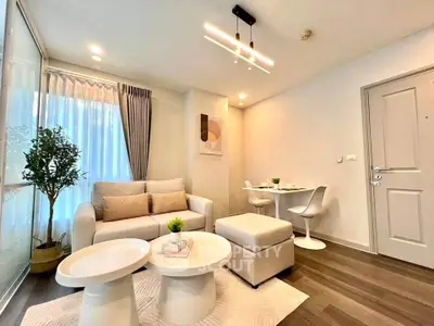Modern living room with stylish furniture and elegant decor in a cozy apartment setting.