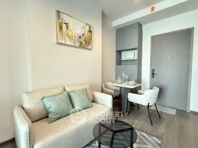 Modern living room with cozy sofa, dining area, and stylish decor in a contemporary apartment.
