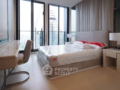 Luxurious modern bedroom with floor-to-ceiling windows and city view