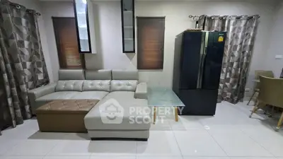 Modern living room with sleek leather sofa and glass coffee table