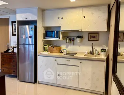 Modern kitchen with sleek cabinets and stainless steel appliances