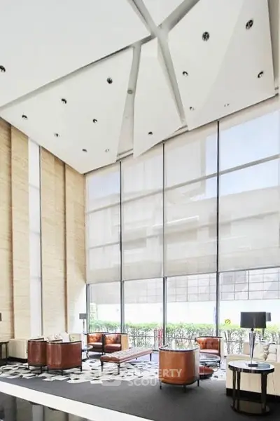 Luxurious modern living room with high ceilings and elegant furniture