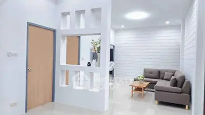 Modern living room with stylish partition and cozy sofa set