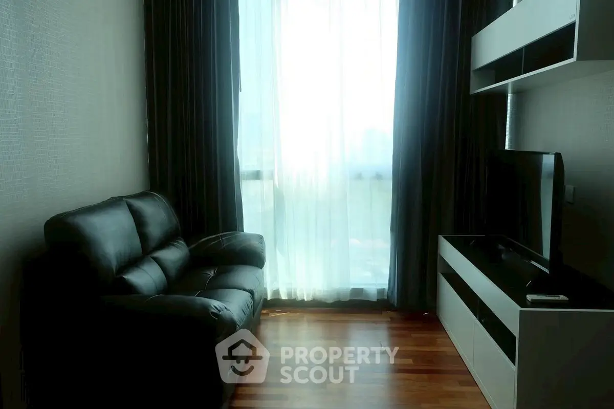 Cozy living room with leather sofa and modern entertainment unit