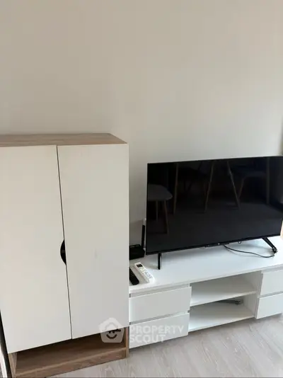 Modern living room with sleek TV setup and stylish cabinet