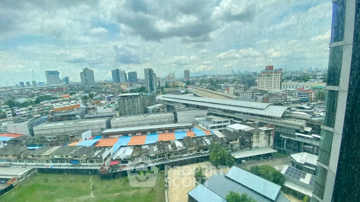 Stunning cityscape view from high-rise building window, showcasing urban skyline and vibrant architecture.