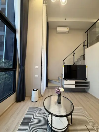 Modern loft apartment with stylish interior and large windows