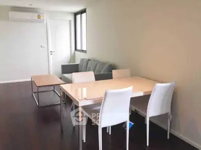 Modern living room with dining area and air conditioning