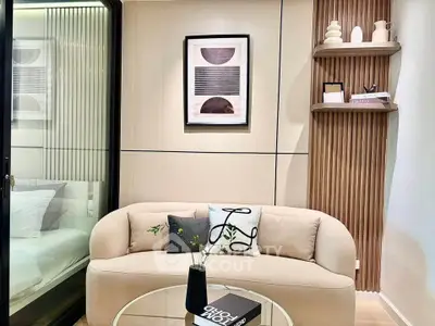 Modern living room with stylish decor and cozy sofa in a contemporary apartment.