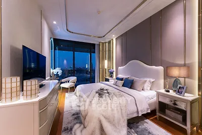 Luxurious bedroom with stunning city view, elegant decor, and ambient lighting for ultimate comfort.