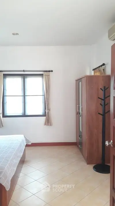 Cozy bedroom with natural light and minimalist decor