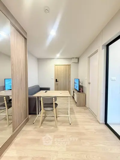 Modern living room with wooden flooring and minimalist furniture