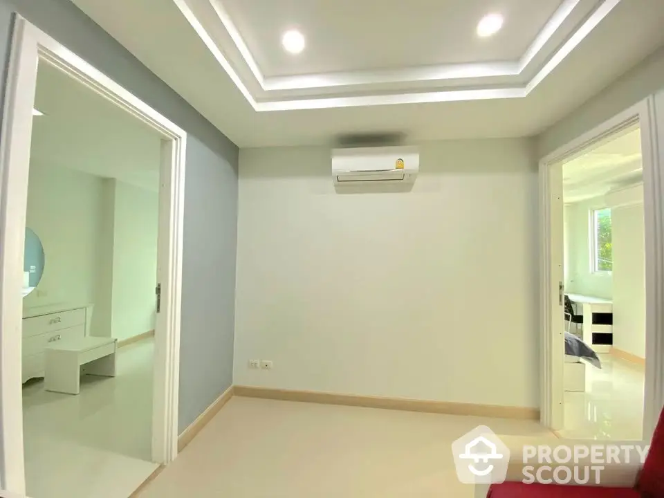 Modern interior with air conditioning and recessed lighting, showcasing a minimalist design.