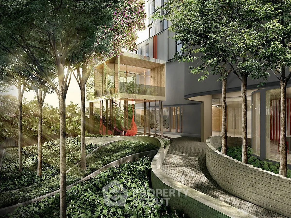 Luxurious modern building entrance with lush garden and elegant architecture.