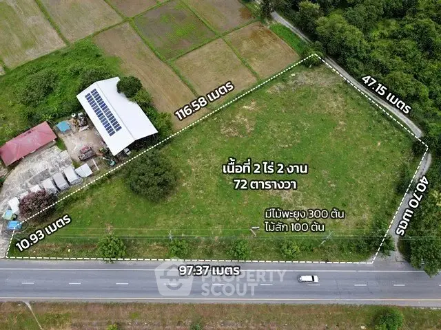 Aerial view of a large plot of land with dimensions marked, ideal for development.