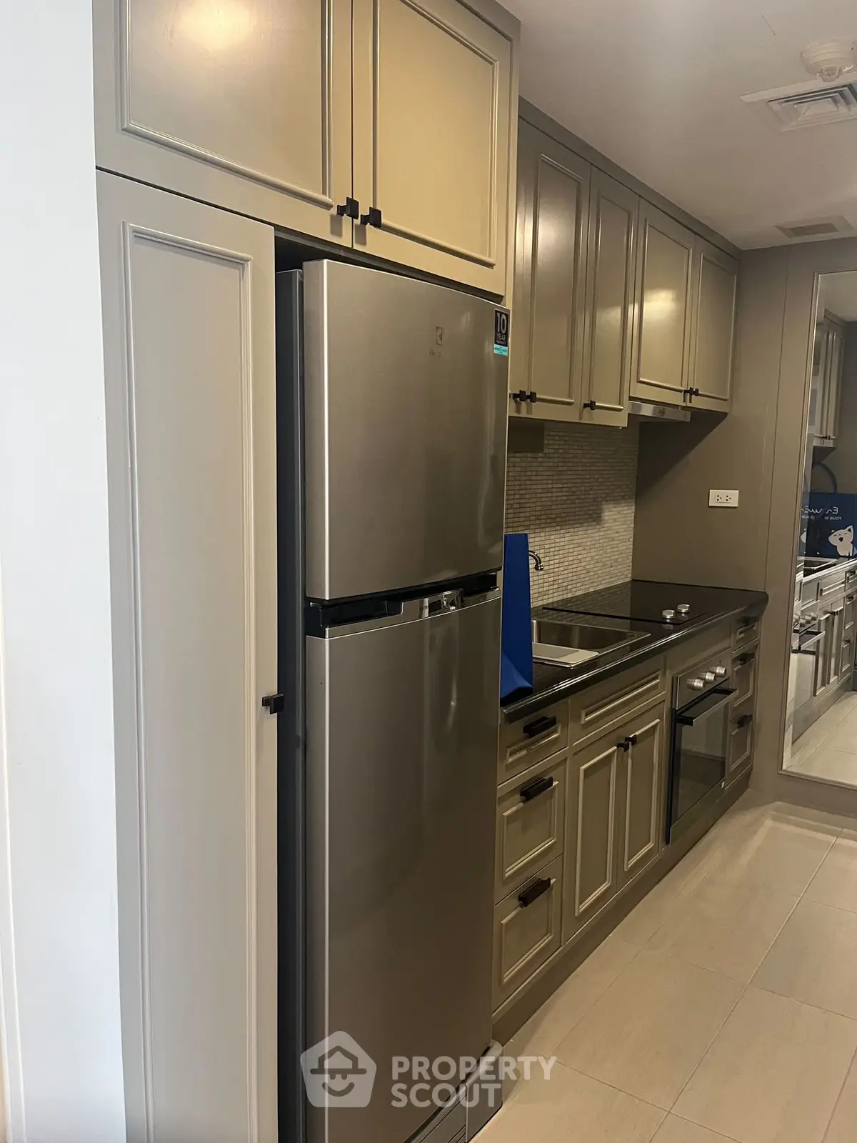 Modern kitchen with sleek cabinets and stainless steel appliances