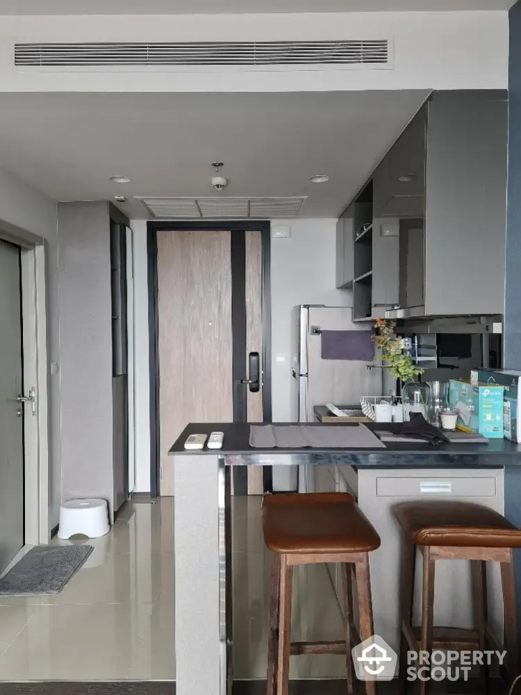 Modern kitchen with sleek design and breakfast bar seating