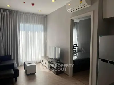 Modern living room with sleek furniture and natural light