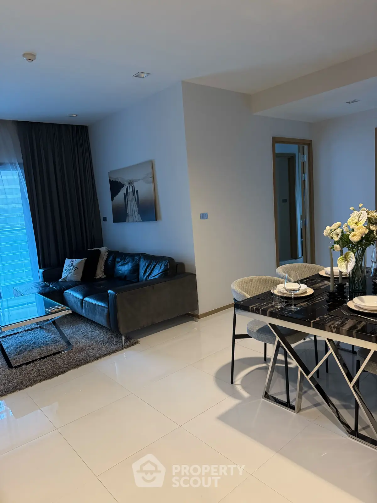 Modern living room with elegant dining area and stylish decor