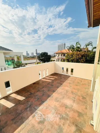 Spacious balcony with stunning city view and ample sunlight, perfect for relaxation and outdoor activities.
