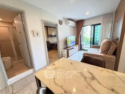 Modern apartment interior with open living room and balcony view