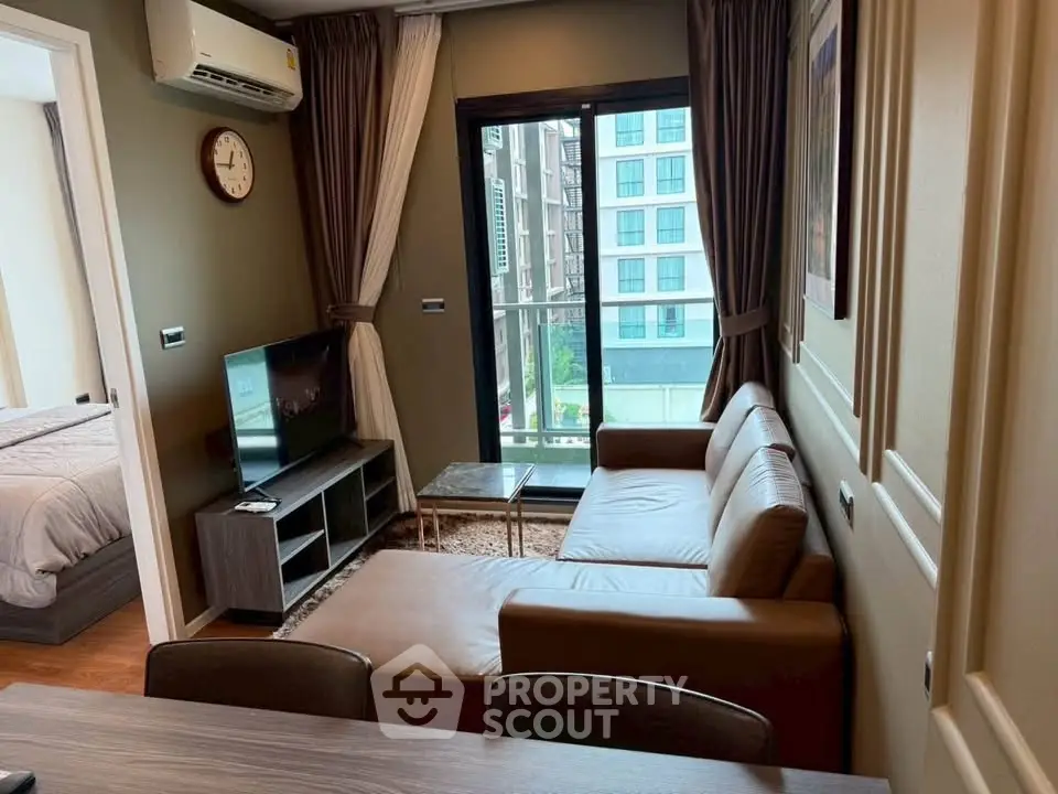 Modern living room with leather sofa and balcony view in stylish apartment