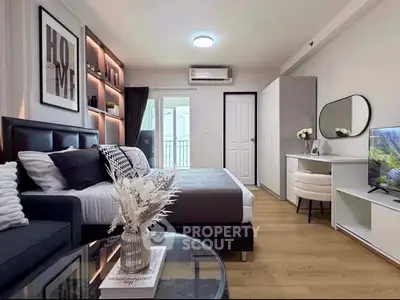 Modern bedroom with stylish decor, cozy bed, and elegant vanity in a chic apartment.