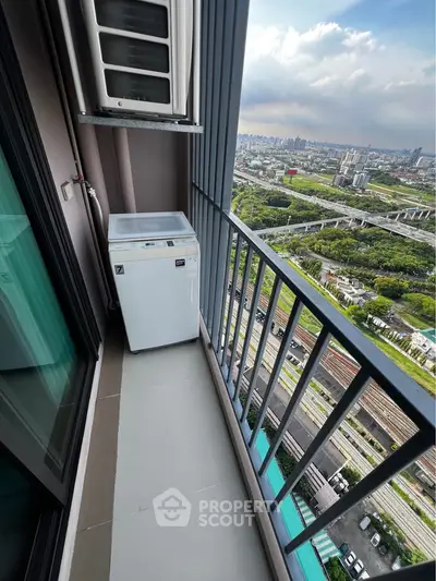 High-rise balcony with washing machine and stunning cityscape view
