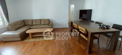 Spacious living room with modern furniture and wooden flooring