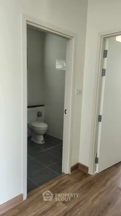 Modern apartment interior with bathroom and wooden flooring