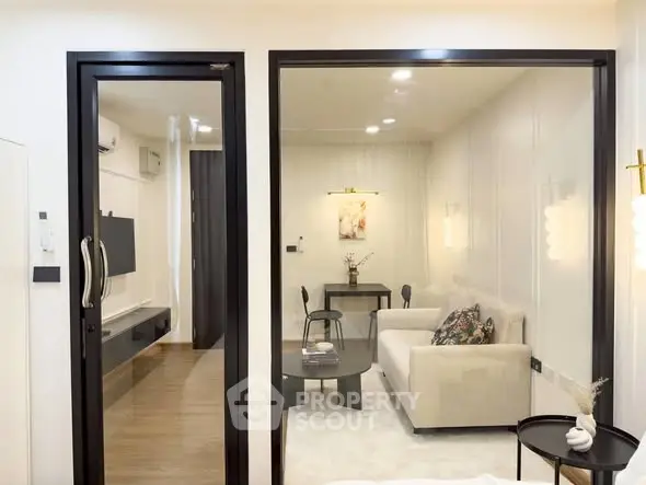 Modern living room with glass partition and stylish decor