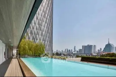 Luxurious rooftop pool with stunning city skyline views in modern high-rise building.