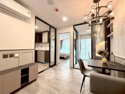 Modern apartment with open layout, stylish dining area, and cozy bedroom view.