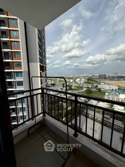 Stunning high-rise balcony with panoramic city views, perfect for urban living.