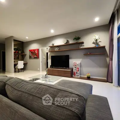 Spacious modern living room with sleek decor and large sofa