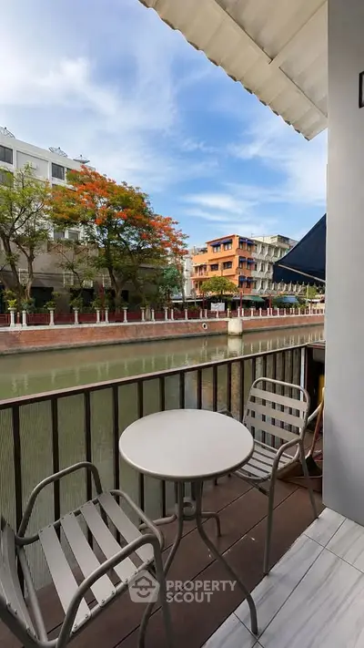 Charming balcony with canal view, perfect for relaxing and enjoying the serene surroundings.