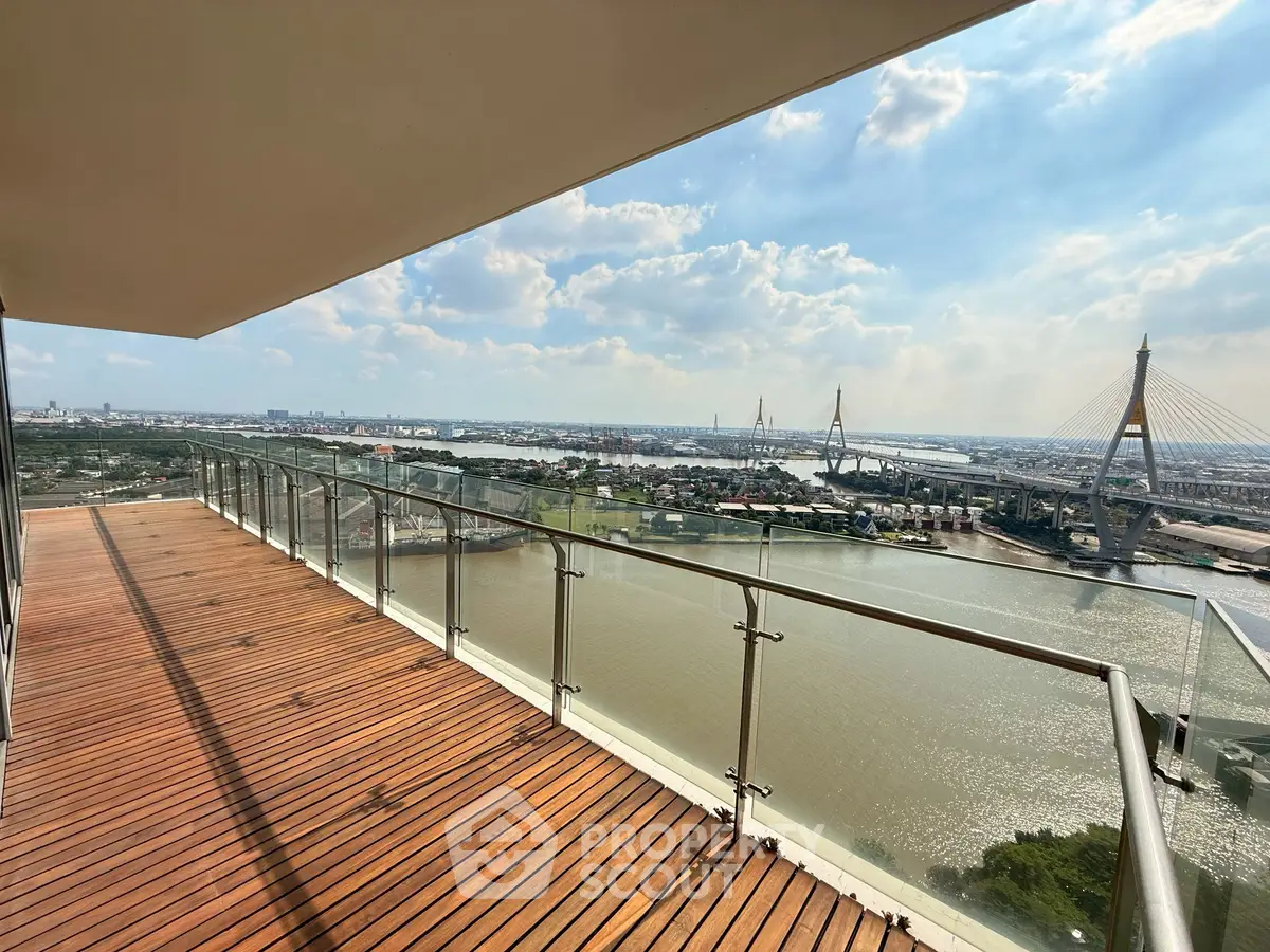 Stunning river view from spacious balcony with modern glass railing