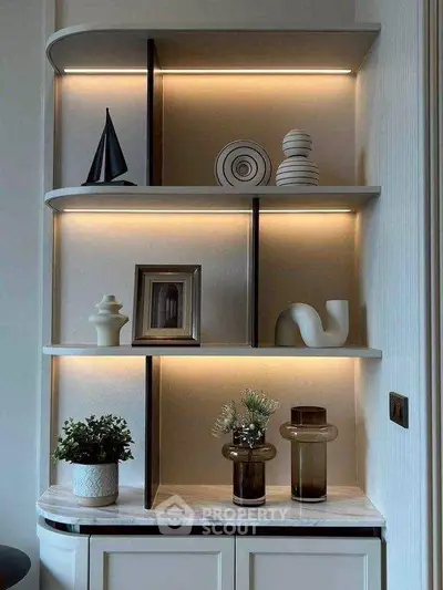 Elegant modern shelving unit with decorative items and ambient lighting