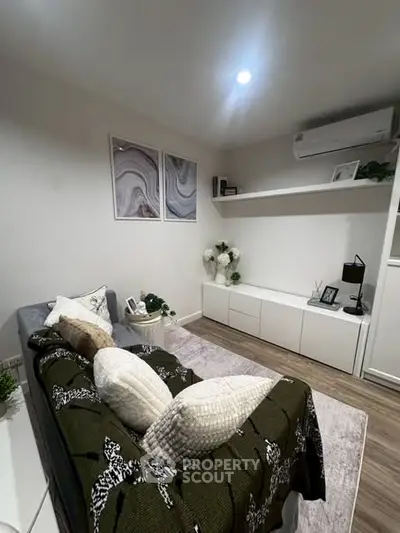 Cozy living room with modern decor and air conditioning