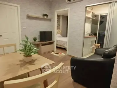 Modern living room with open layout and cozy bedroom view