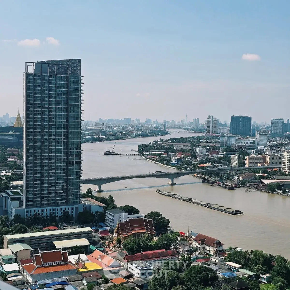 Stunning high-rise building with river view in vibrant cityscape