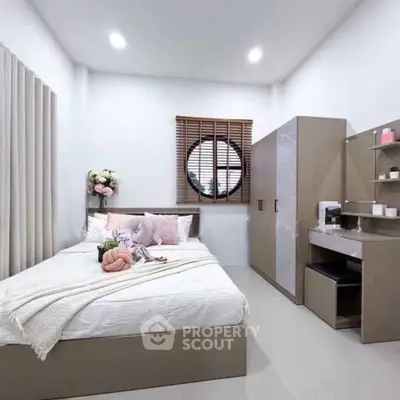 Modern bedroom with stylish decor and ample storage space