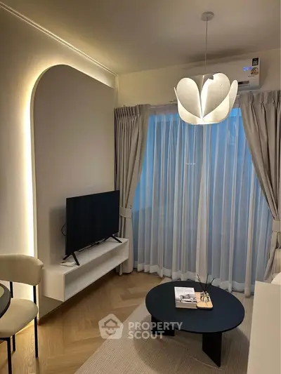 Modern living room with stylish lighting and elegant decor