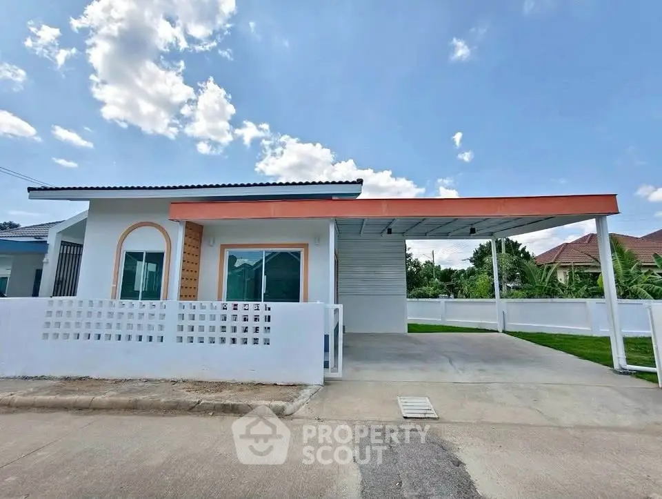 Modern single-story house with carport and spacious driveway