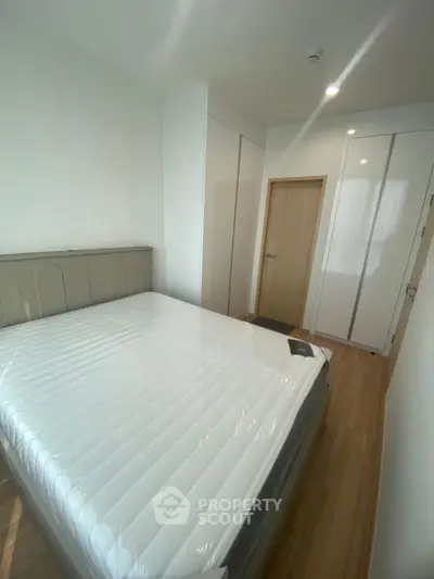 Modern bedroom with sleek design and ample natural light