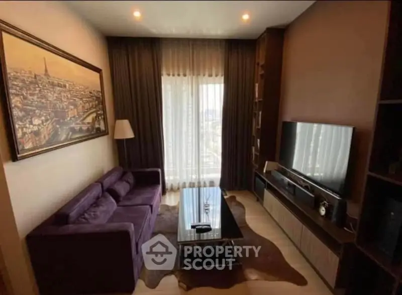 Elegant living room with plush purple sofa, large TV, and cityscape artwork, perfect for modern urban living.