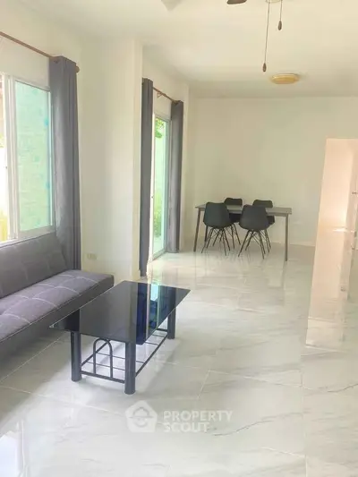 Bright modern living room with sleek furniture and large windows