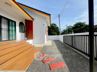 Charming single-story home with modern exterior and spacious outdoor area.