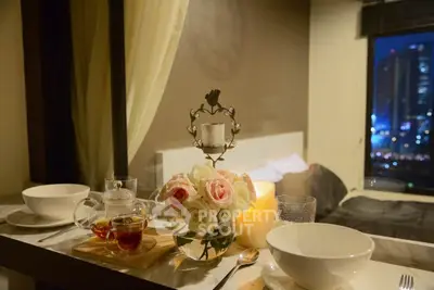 Cozy bedroom with city view, elegant dining setup, and ambient lighting.